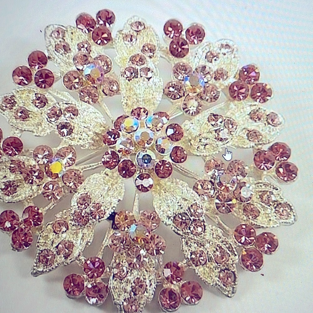 Beautiful rhinestones pink soft shades, can be converted to a hair accessory